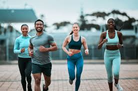 Sculpting Sleek Arms: The Essential Role of Cardio in Toning Without Bulking Up 3 image of people running to incorporate cardio Herne exercise into their life to help tone arms and body.
